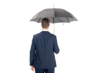 back view of stylish businessman posing with umbrella isolated on white