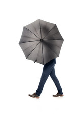 businessman posing with black umbrella isolated on white