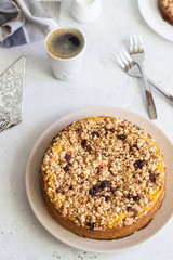 Cheesecake with pumpkin and crumble. No crust cheesecake. Healthy dessert. Light concrete background. Copy space.