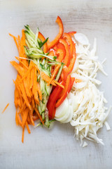 Chef cuts the vegetables into a meal. Preparing dishes. A man uses a knife and cooks.