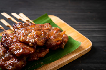 grilled skewered milk pork with white sticky rice