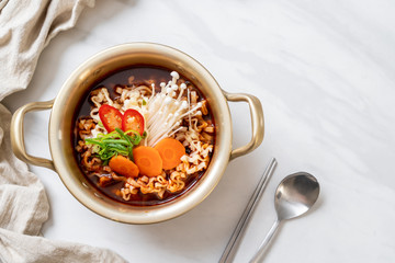 korean instant noodles in golden pot