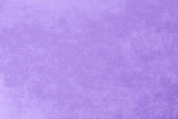 It is a background of fabric of beautiful violet color of non-uniform texture.