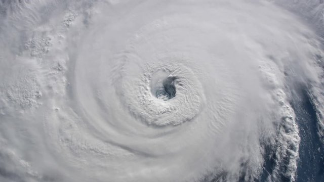 Hurrican eye satellite view rotating clouds animation. Contains public domain image by Nasa