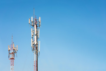 Telecommunication tower on blue sky background.  