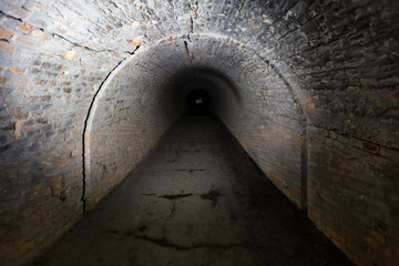 Brick underground tunnel for museum building with illuminated light