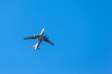 bottom view of a flying big airplane against the sky