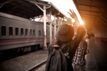 Happy young couple on railway station platform