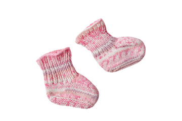 Children clothes concept on a white background. Pink knitted booties. Isolate