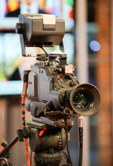 TV camera behind the scenes of video production or video shooting at studio