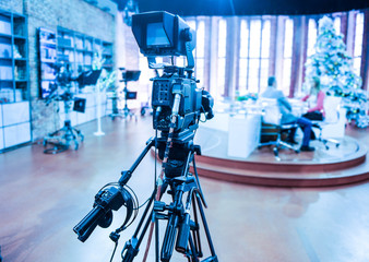 TV camera behind the scenes of video production or video shooting at studio