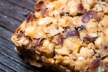 Integral crackers with healthy seeds: linseeds, chia, cracked pumpkin seeds, sunflower, sesame and spices with whole wheat flour. Macro photography