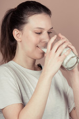 girl drinks milk and is happy