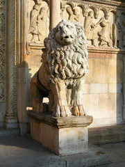 Lion statue in the main entrance of the Cathedral of Modena, Italy 