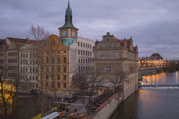 Bright lights of evening Prague, cityscape of Prague bridges, view of Charles Bridge