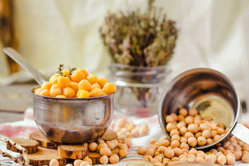 Dried and boiled chickpeas. Vegetarian protein. Dry thyme sprigs in a jar. Healthy lifestyle and balanced food concept. Selective focus.