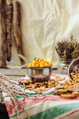 Dried and boiled chickpeas. Vegetarian protein. Dry thyme sprigs in a jar. Healthy lifestyle and balanced food concept. Selective focus.