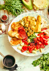 Green fresh salad with tomatoes, pink lentil mashed potatoes, baked potato slices with homemade ketchup.Comfort food concept. Top view.