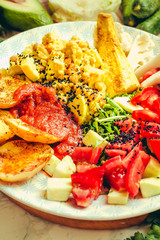 Green fresh salad with tomatoes, pink lentil mashed potatoes, baked potato slices with homemade ketchup..Healthy lifestyle and balanced food concept. Selective focusClose-up.