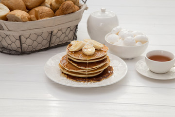 Breakfast with pancakes and tea