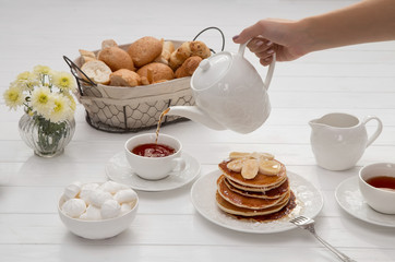 Breakfast with pancakes and tea