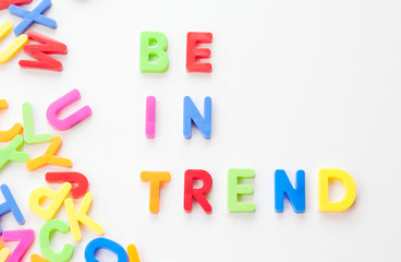 Obraz premium Trends concept. Coloured letters on white background. Be in trend