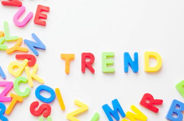 Trends concept. Coloured letters on white background. Be in trend