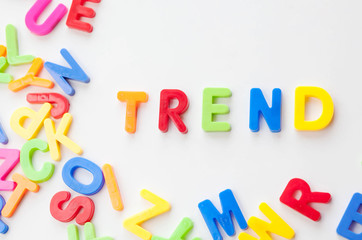 Trends concept. Coloured letters on white background. Be in trend