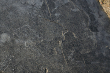 Dark grey black slate background or texture. black stone blur