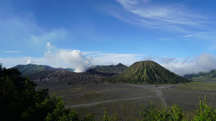 Fototapeta premium Steam clouds coming out from Mount Bromo, an active volcano in the Bromo Tengger Semeru National Park in East Java, Indonesia.