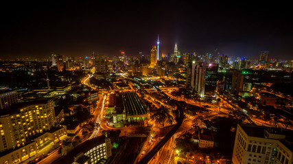 Cloudy sunset over Kuala Lumpur City Skyline showing the transportation arteries withing the heart of the city's transportation hub.