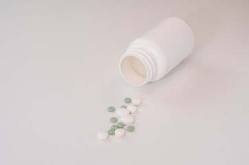 Tablets are laid on a white table.