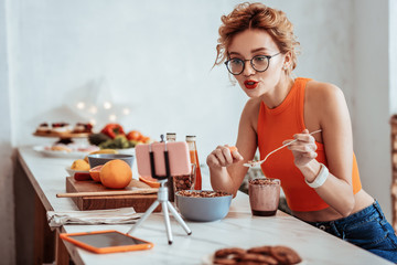 Nice pleasant woman pointing at the spoon