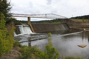 Embankment of hydroelectric power on the river.