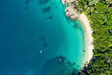 View from above, aerial view of a beautiful tropical beach with white sand and turquoise clear water, Banana beach, Phuket, Thailand. - obrazy, fototapety, plakaty