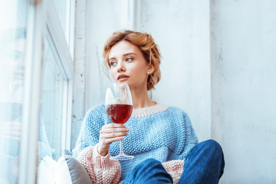 Nice Young Woman Drinking Red Wine Alone