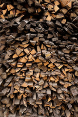 A pile of firewood, sawn timber production waste. Raw materials for the fireplace, stove.