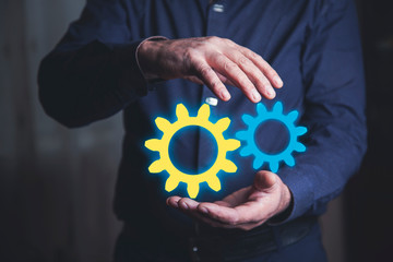 Business man hand show gear