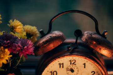 Old alarm clock on the window