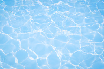 Fototapeta na wymiar Surface of blue swimming pool texture, background of water in swimming pool