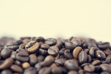 Brown roasted coffee beans, seed on aged background