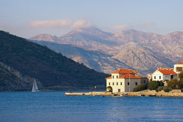 Beautiful winter Mediterranean landscape. Small seaside village at the foot of the mountains....