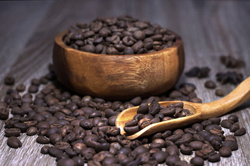 roasted coffee bean on wooden bowl and spoon