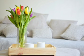 bouquet of tulips on a tray and in the background 