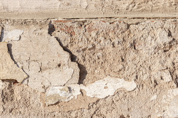 Background texture. Cracked concrete wall covered by grey cement surface