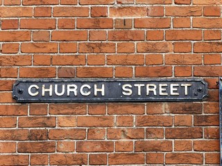 Church Street sign attached to brick wall