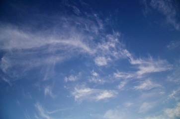 Beautiful natural pattern of white clouds and blue sky. Waving white clouds and consecutive blue color from bright to dark with freedom.