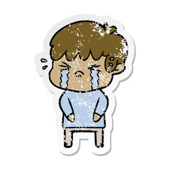 distressed sticker of a cartoon boy crying
