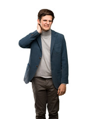 Teenager man with turtleneck having doubts over isolated white background