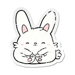 distressed sticker of a cartoon rabbit